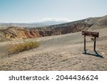 Desert hiking. Little Hebe Crater sign in Death Valley National Park, California