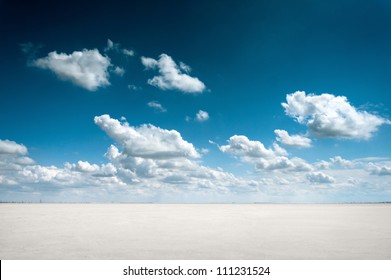 Desert Landscape With Deep Blue Sky And Clouds