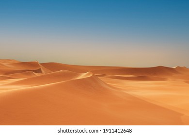 desert landscape dunes with blue sky. Sand mounds formed in circular shape, beauty of natural changes over great stretches