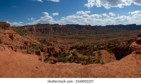 Desert landscape. Panorama view of the red sandstone and rock formations, cliffs, mountains and valley in Sierra de las Quijadas national park. 