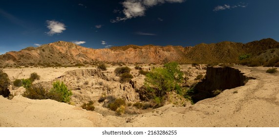Desert landscape. Panorama view of the sandstone formations, canyon, rocky mountains, yellow sand and cliffs in Pampa del Leoncito park in San Juan, Argentina. - Shutterstock ID 2163286255