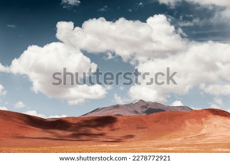 Desert landscape with red hills and the blue sky with clouds, Altiplano plateau, Bolivia. South America landscapes