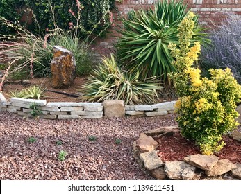 Desert Landscaping With Rock And Shrubs