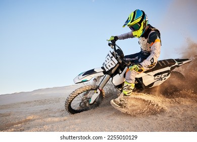 Desert, moto cross or sports adventure athlete in sand for exercise, workout or speed. Travel, dirt and bike with energy of man in Dubai race on dirt with challenge and sport fitness with freedom