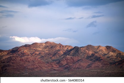 Desert Mountain Range With Cloudy Sky