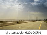 Desert road and dramatic sky,