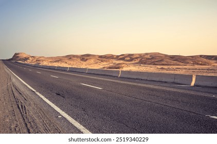 Desert road at sunset, color toning applied, Egypt. - Powered by Shutterstock