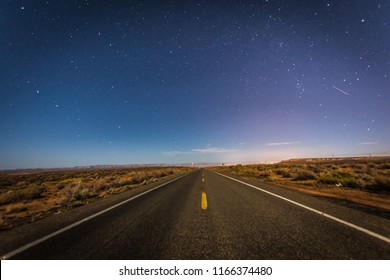 Desert road under the stars in Arizona - Powered by Shutterstock