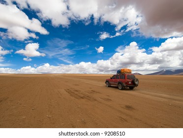 desert road, white clouds and deep blue sky