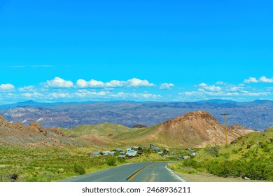Desert road winds its way through an abandoned settlement nestled in the Nevada wilderness. - Powered by Shutterstock