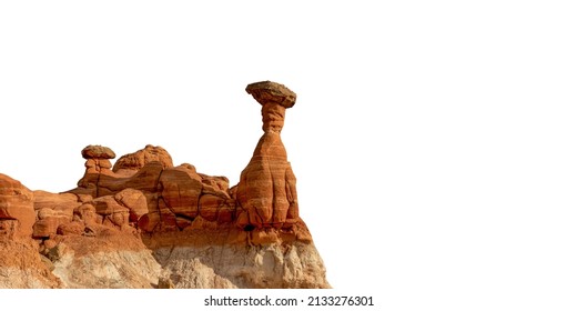 A desert rock formations, shaped by wind erosion, isolated on white background