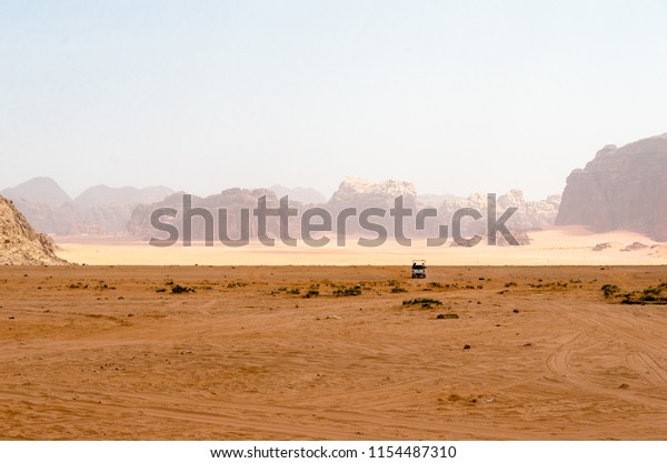 Desert safari - offroad vehicle in the\
UNESCO world heritage site Wadi Rum desert,\
Jordan