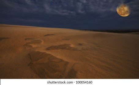 Desert Sand Dunes And Rising Moon