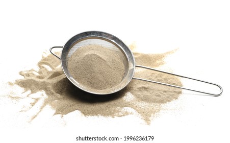 Desert sand pile with metal kitchen sift, sieve isolated on white background - Powered by Shutterstock