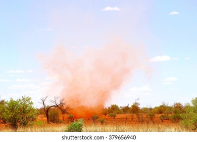 Desert Sand Storm, Red Dust Clouds Moving High Up In The Sky At Uluru Ayers Rock, Northern Territory, Australia. Due To Very High Temperatures And Extreme Hot Weather Conditions