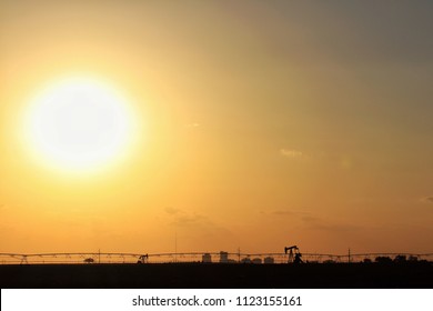 Desert Sun And Permian Basin Silhouettes