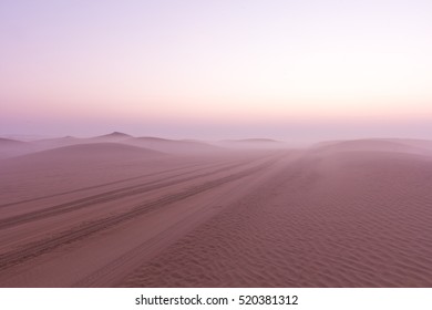 Desert sunrise with fog in Dubai, United Arab Emirates.