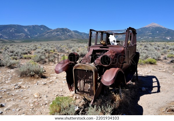 A deserted car with a horse\
skeleton driver, just outside Great Basin National Park,\
Nevada.\
