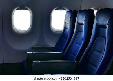 deserted economy class airplane seats rows - Shutterstock ID 2302504887