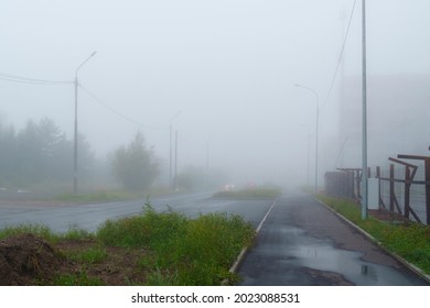 Deserted Foggy City Street In Summer Evening