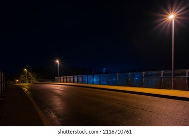 Deserted Wet Road At Night In The Small Town Of Luckenwalde