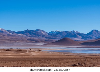 Desertic landscape and Andes mountain range in the bolivian plateau - Powered by Shutterstock