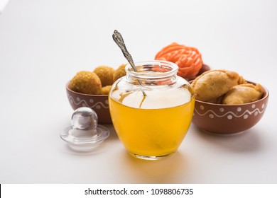 Desi Ghee With Indian Sweets Like Gujiya, Motichoor Laddu And Imarti Or Jalebi