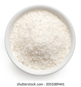 Desiccated Coconut In White Ceramic Bowl Isolated On White. Top View.