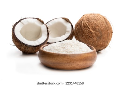 Desiccated  Coconut In Wooden Bowl Isolated On White 