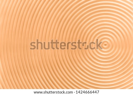 Design concept - abstract yellow plastic concentric circle texture background, not 3d render