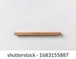 Design concept - front view empty bookshelf and grey wall for mockup, not 3D render