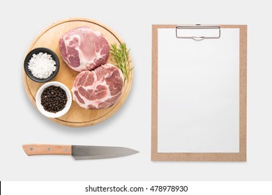 Design Concept Of Mockup Clip Board And Pork On Cutting Board Set Isolated On White Background. Clipping Path Included Isolated On White Background.