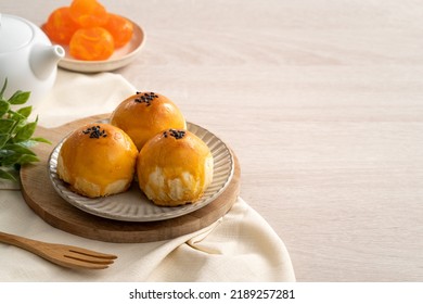 Design concept of Moon cake yolk pastry, mooncake for Mid-Autumn Festival holiday on wooden table background