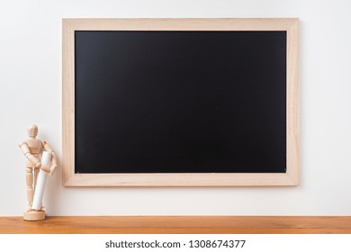 Design concept - Perspective view of blackboard and wood doll on white background  with teak floor for mockup - Powered by Shutterstock