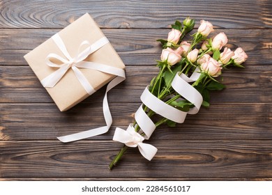 design concept with pink rose flower and gift box on colored table background top view. Happy Holiday, Mothers day, birthday concept. Romantic flat lay composition. - Powered by Shutterstock