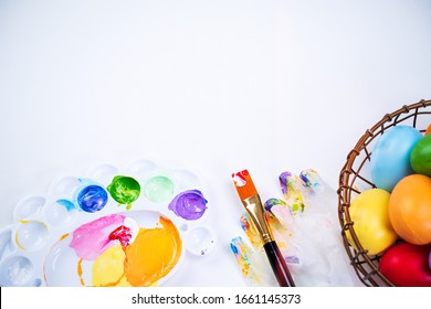 Design Concept - Preparing For Easter Celebration, Painting Easter Eggs With Colorful Acrylic Pigment Color Dyestuff In Palette, Close Up, Lifestyle.