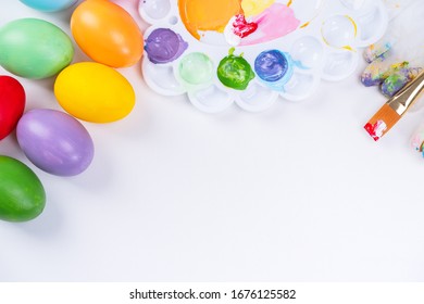 Design Concept - Preparing For Easter Celebration, Painting Easter Eggs With Colorful Acrylic Pigment Color Dyestuff In Palette, Top View, Lifestyle.