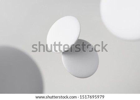 Design concept - top view of 2 white badge float on white background with blur effect for mockup, it's real photo, not 3D render