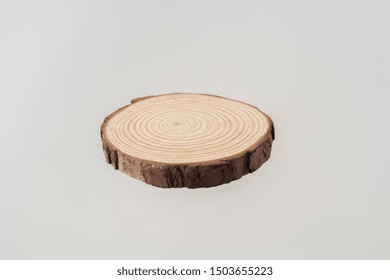 Design Concept - Top View Of Circular Wood Piece With Annual Ring Isolated Float In Air On White Background For Mockup, It's Real Photo, Not 3D Render