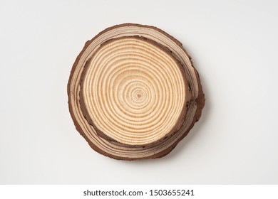 Design Concept - Top View Of Circular Wood Piece With Annual Ring Isolated On White Background For Mockup, It's Real Photo, Not 3D Render