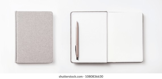 Design concept - Top view of hardcover gray linen notebook and ballpoint pen isolated on white background for mockup