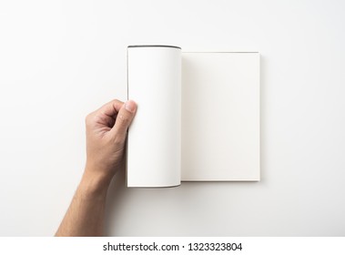 Design concept - Top view of man's hand hold high grade brown notebook isolated on white background for mockup series 6