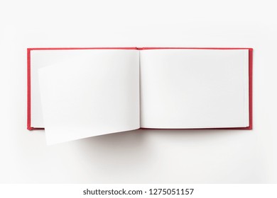 Design Concept - Top View Red Hardcover Notebook With Open & Flip Curl Rolled Page Isolated On Background For Mockup