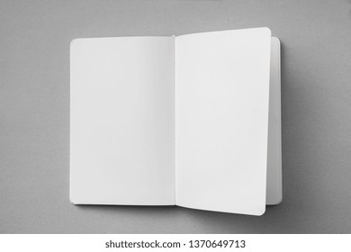 Design Concept - Top View Of White Notebook With Blank Open, Turn And Flipped Page On Grey Background For Mockup. Real Photo, Not 3D Render