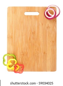 Design element of a clean, new cutting board and vegetable slices