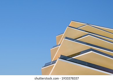 Design elements contemporary building detail architecture concrete and glass facade on clear blue sky background real estate concept. Modern architecture building facade with balconies. New apartments