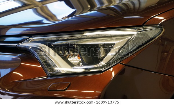 Design\
of a modern car. Front of the car, front headlight. Service and\
repair concept.                                  \

