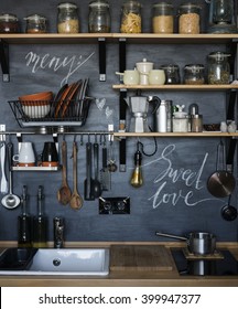 The Design Of The Modern Home Kitchen In The Loft-style And Rustic. 
Black Wall With Shelves , Trays , Jars , Mugs , Sink .