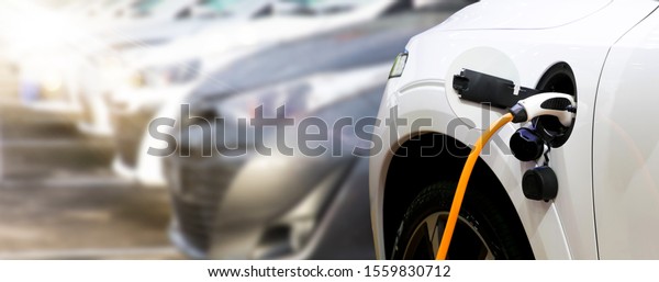 Design of panoramic horizontal web\
banners with space for text. Loading energy of an electric car in\
republic parking. Charging station for electric car\
recharge.