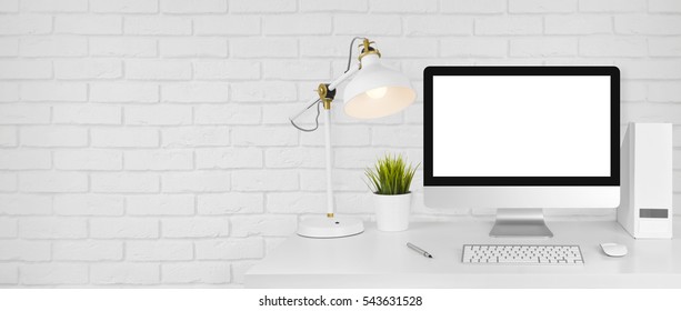 Design studio concept with workplace and white brick wall background